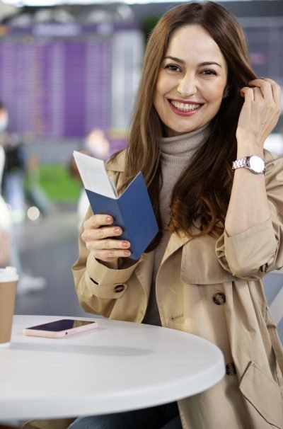 medium-shot-smiley-woman-with-passport